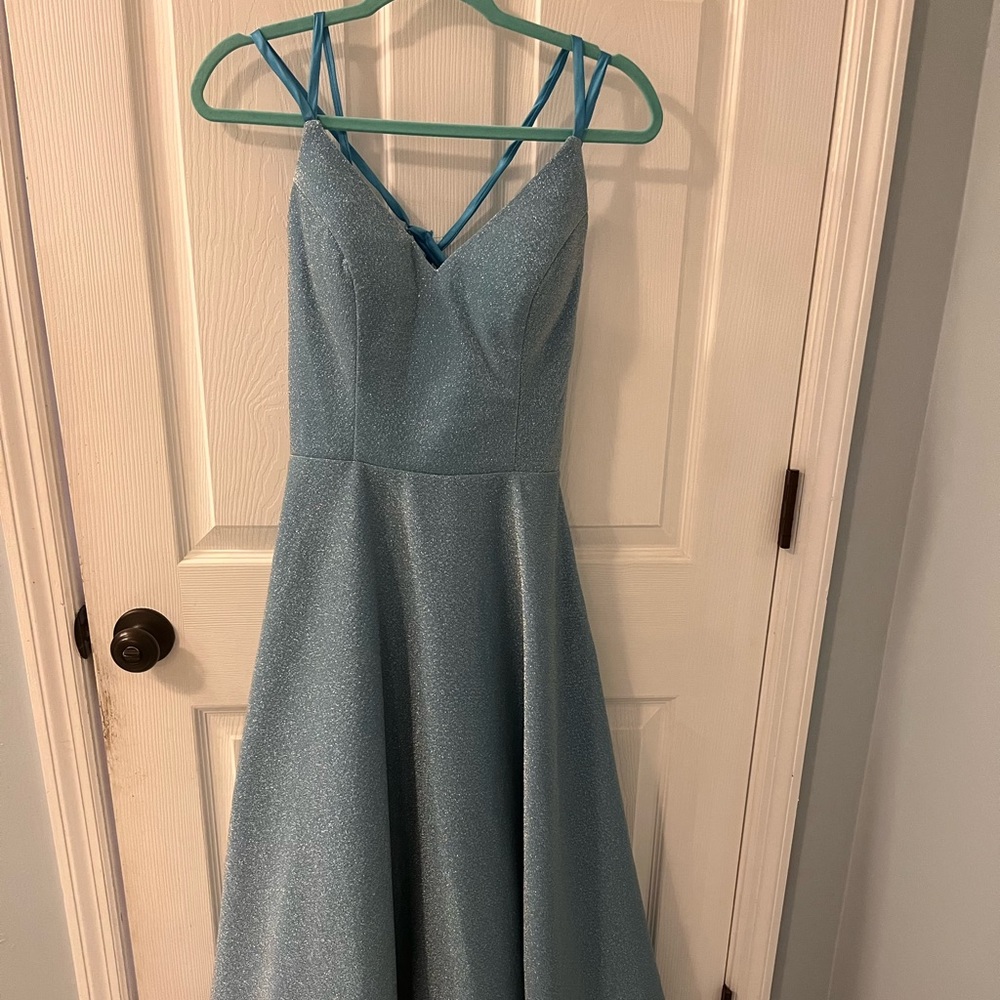 Long formal/prom dress with pockets. Lace up back. Never worn.